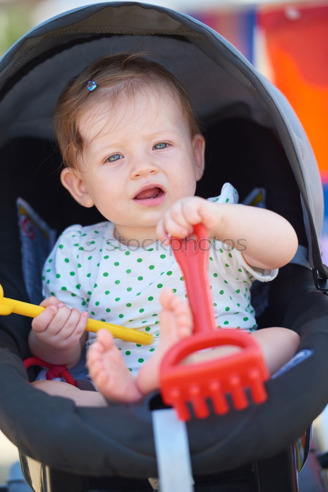 Similar – Young girl playing to driving a toy car