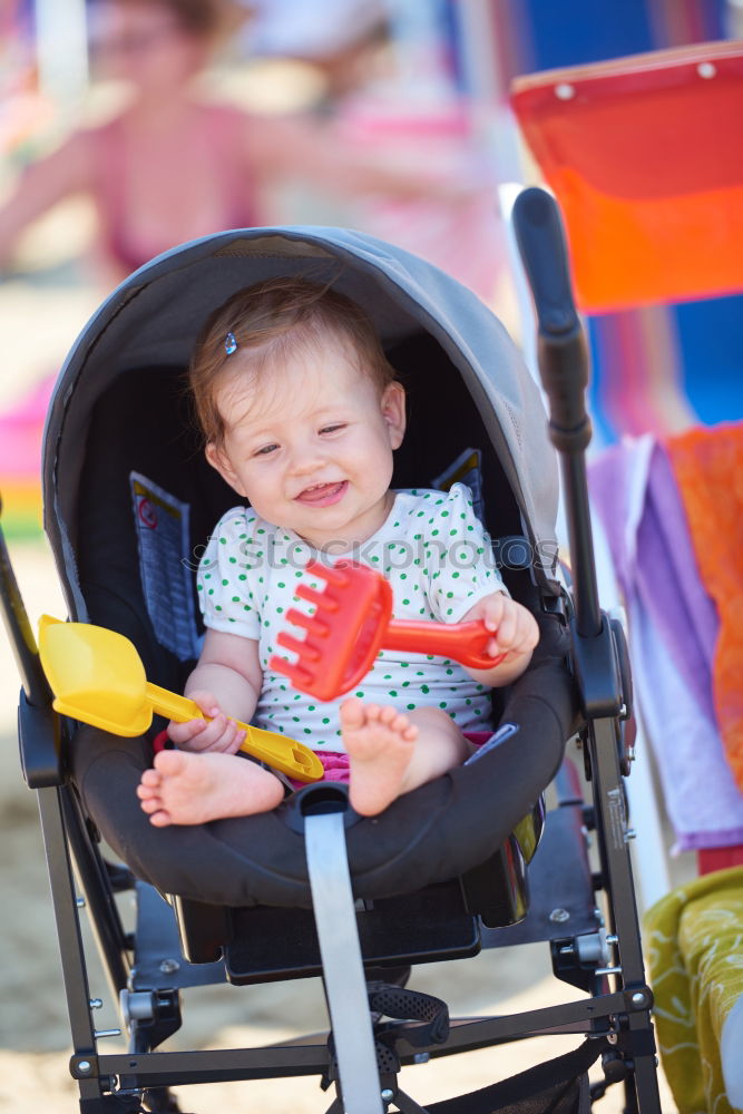 Similar – Image, Stock Photo Beautiful baby playing with her toys at carriage in a walk at park