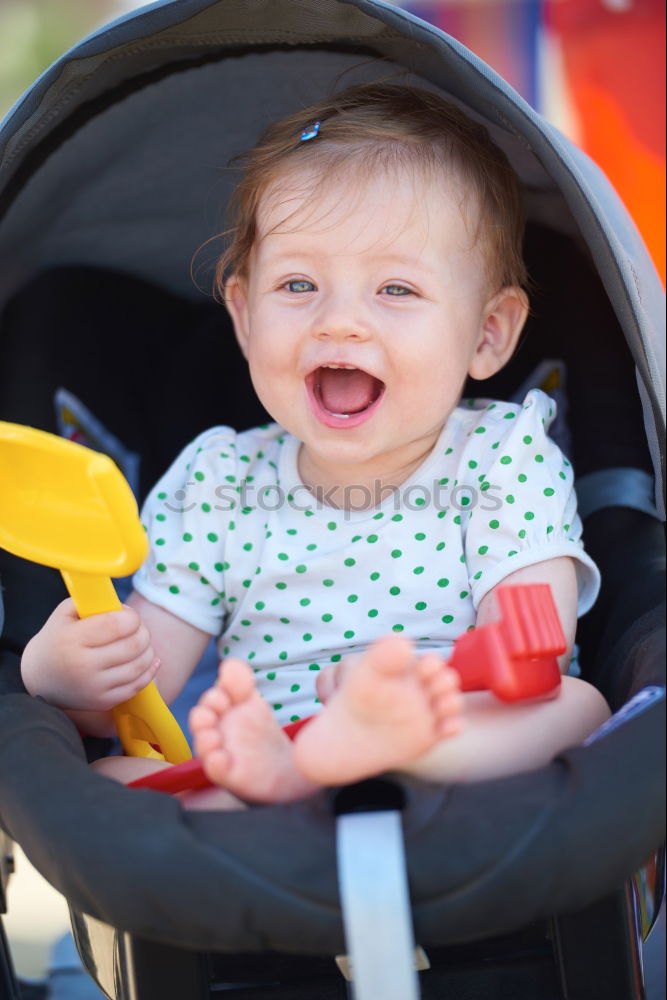 Similar – Young girl playing to driving a toy car