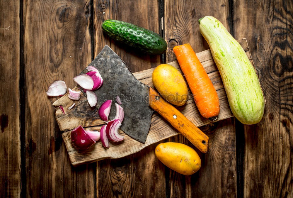 Similar – Fresh carrots on the chopping board