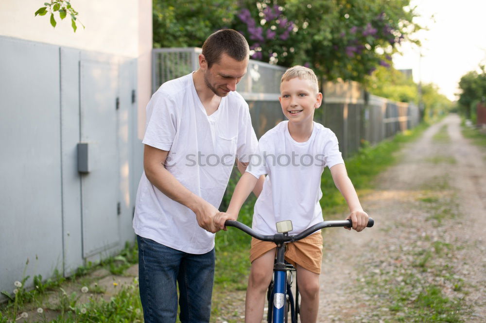 Similar – Father and daughter playing on the road at the day time.