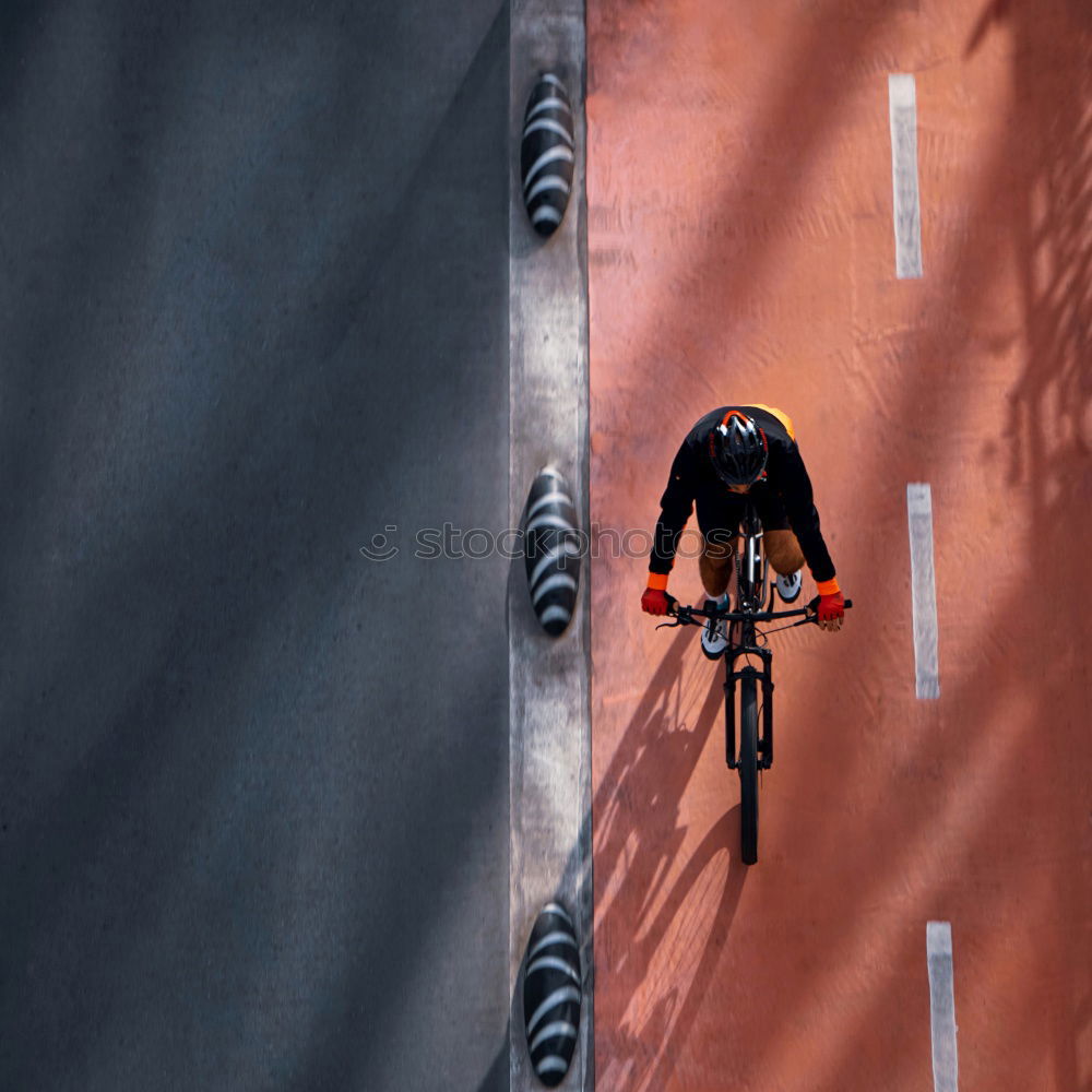 Image, Stock Photo Cyclist riding along a paved mountain road