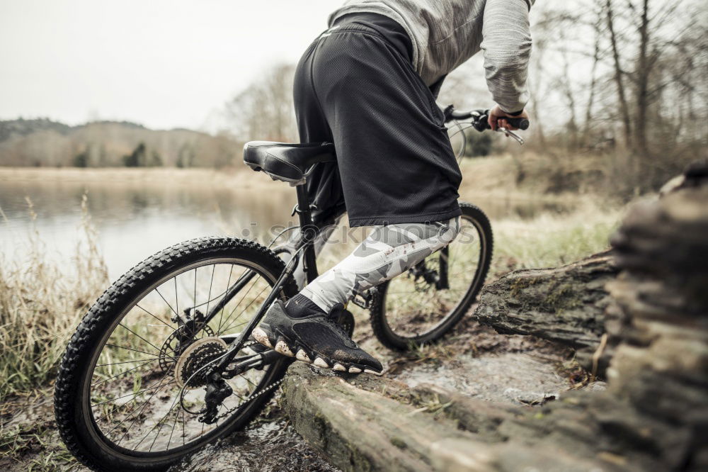 Similar – Image, Stock Photo Man walking with mountain biking