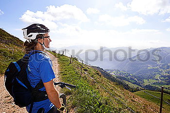 Similar – Image, Stock Photo Women riding bikes in countryside