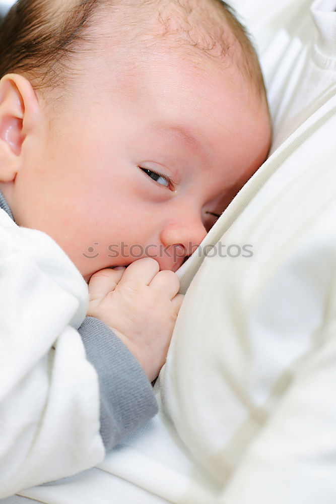 Similar – The back of a baby’s head lying on its stomach