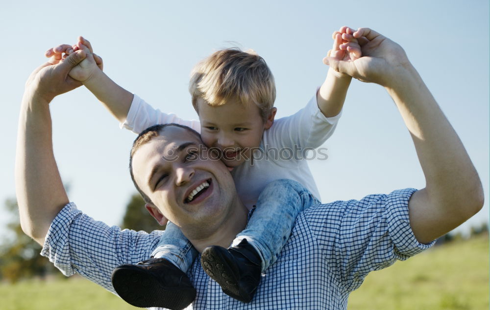 Similar – Father and son playing in the park at the day time.