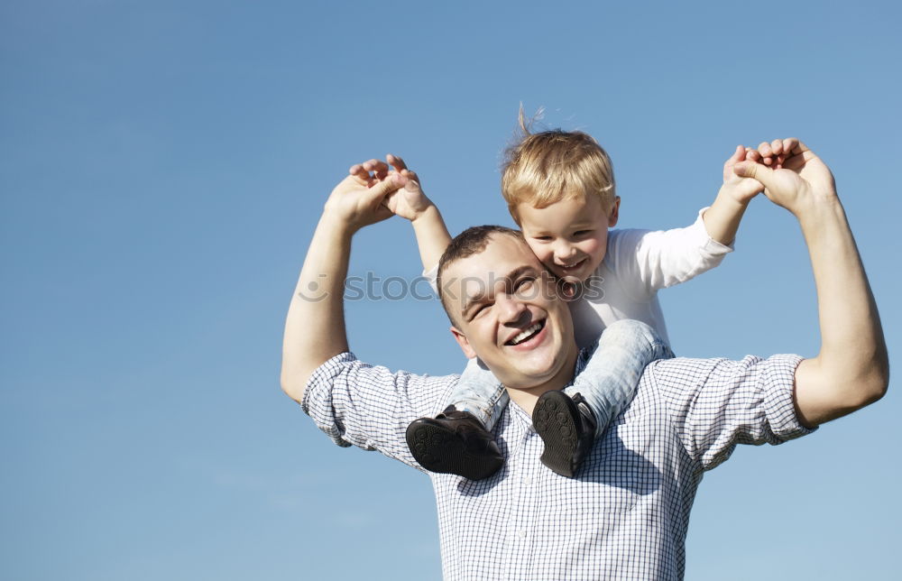 Similar – Father and son playing in the park at the day time.