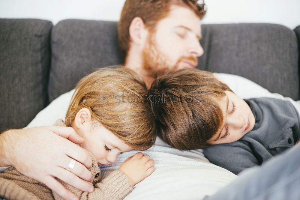 Similar – Couple laying on couch watching TV together