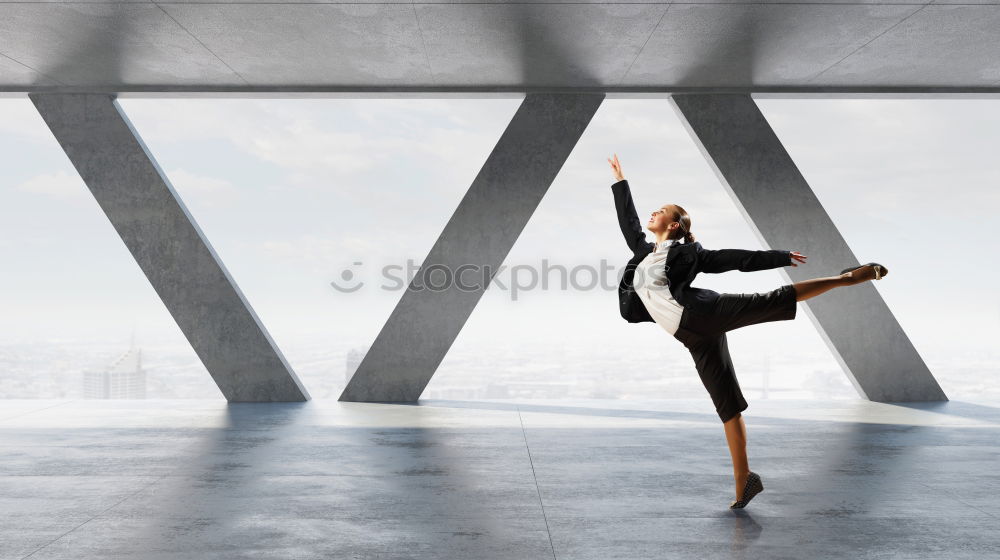 Similar – Athletic man balancing on gymnastic rings