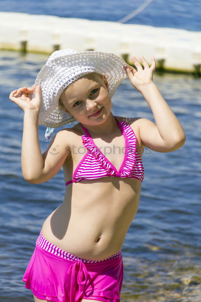 Similar – Image, Stock Photo Girl on the riverbank in pink swimsuit