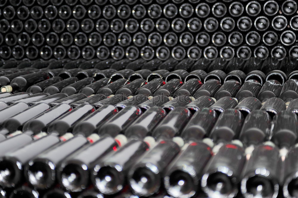 Similar – Image, Stock Photo Red wine bottle with red wine glass and grapes on black