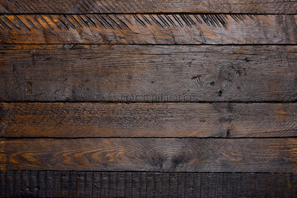 Similar – Brown wooden background with black frying pan