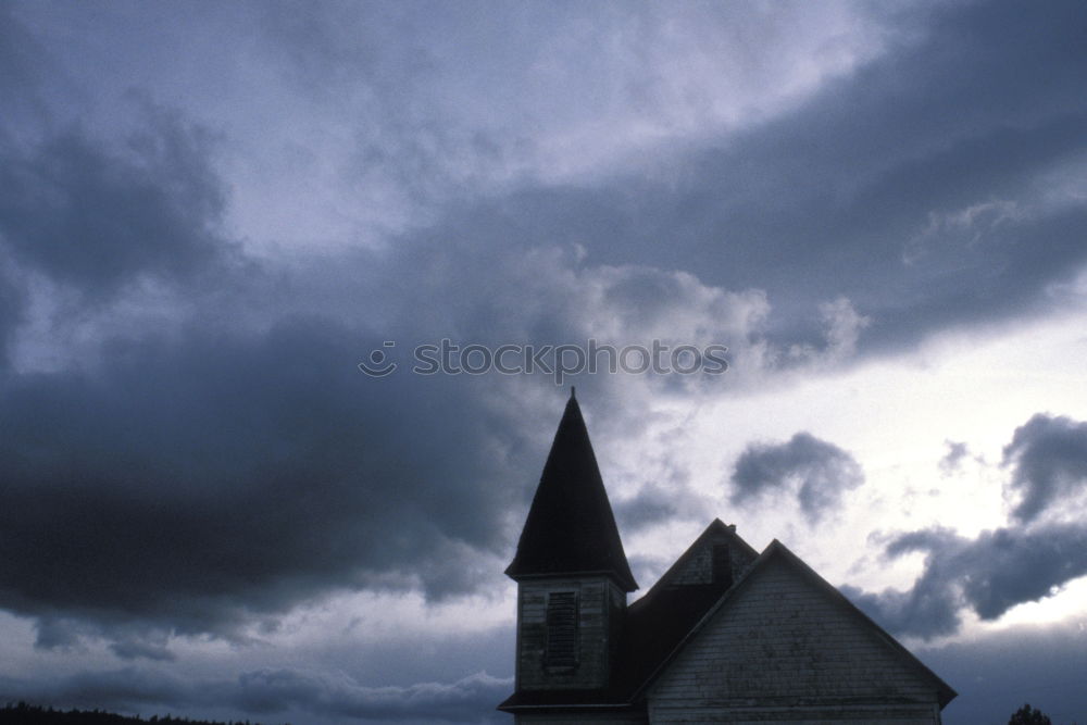 Similar – Church tower with layered clouds