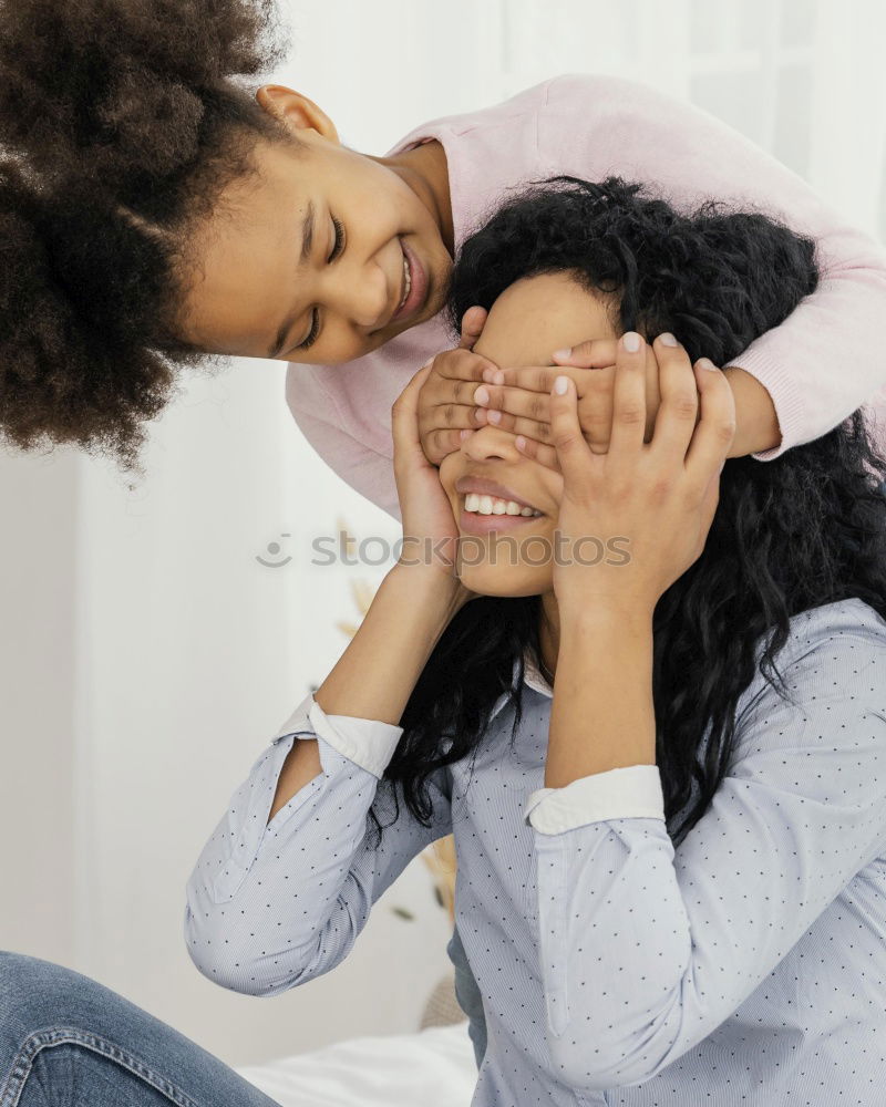 Similar – Happy mom and daughter using digital tablet together