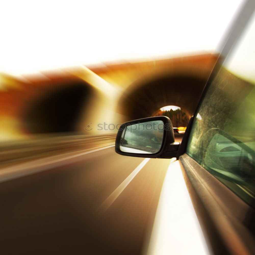 Similar – Image, Stock Photo Sunny car ride. View through the windshield onto the highway. Eyes and glasses of the driver as reflection in the rear view mirror.