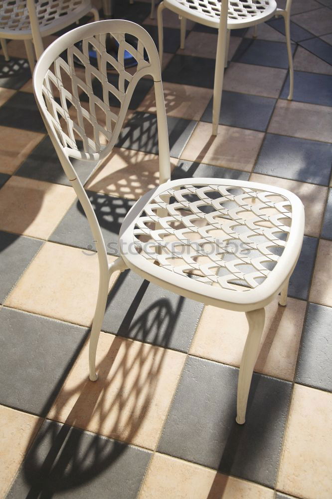 Similar – Street cafe with empty, colourful chairs and tables