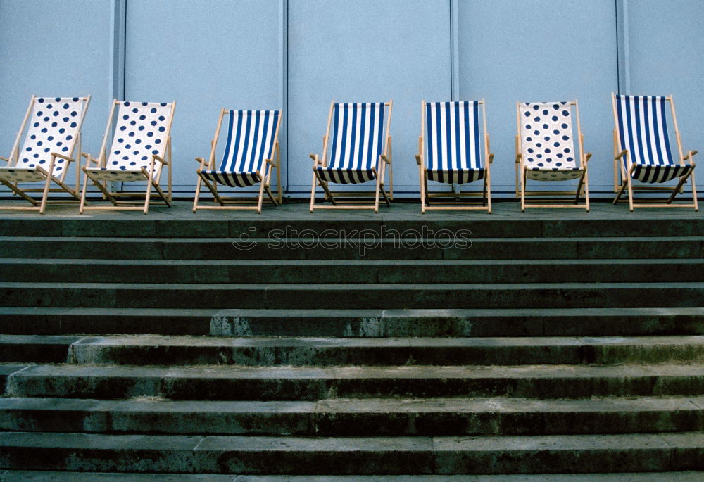 Similar – metallic chairs on the street