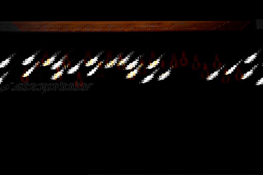 Similar – Image, Stock Photo Theme day: diverse/candlelight, candle offering in a church. Many candles are placed on a staircase. With dark background.