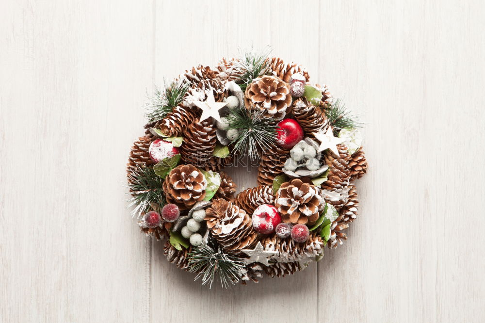 Similar – Delicate Christmas wreath of pine cones on wooden background