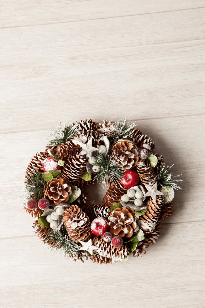 Similar – Delicate Christmas wreath of pine cones on wooden background