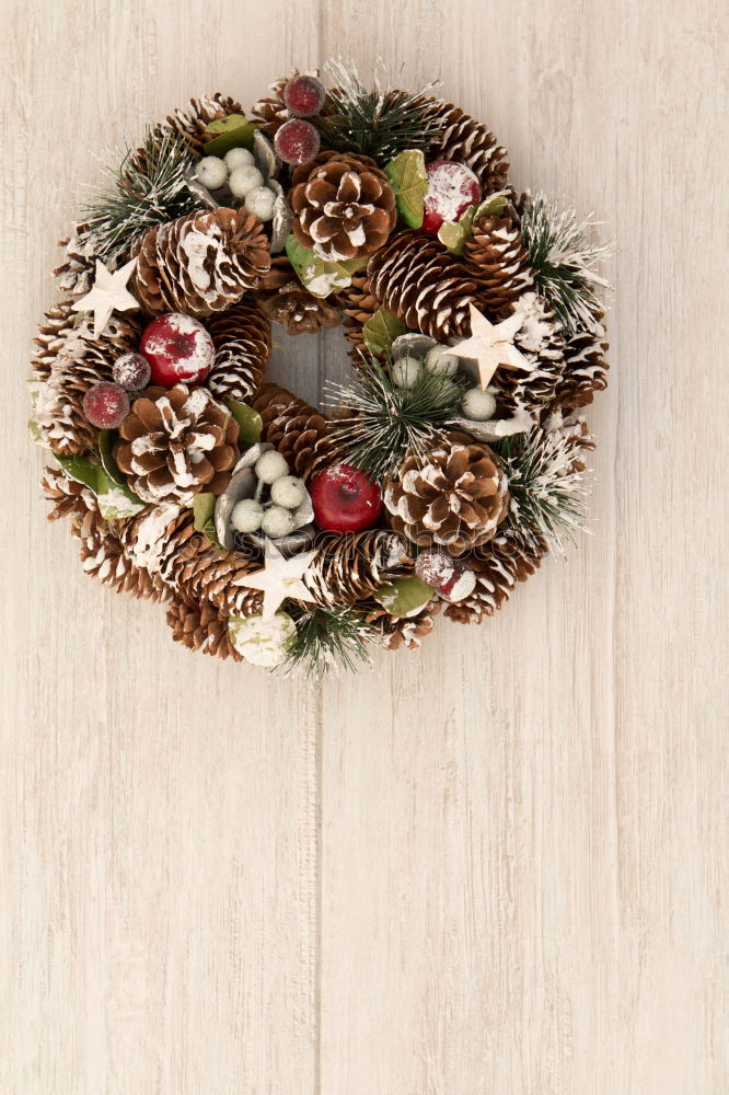 Similar – Delicate Christmas wreath of pine cones on wooden background