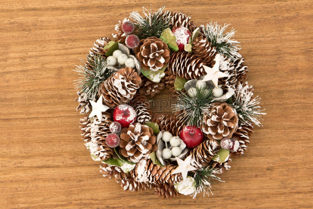 Similar – Delicate Christmas wreath of pine cones on wooden background