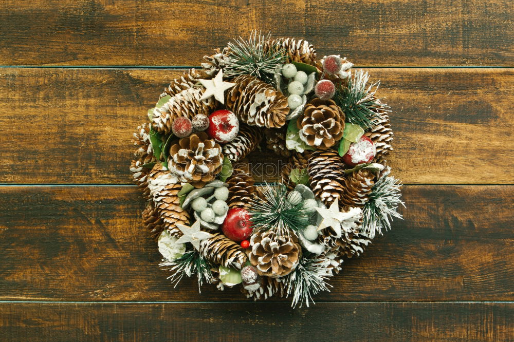 Similar – Delicate Christmas wreath of pine cones on wooden background