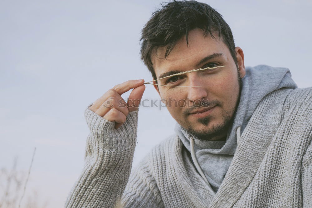 Similar – Young man posing outdoors