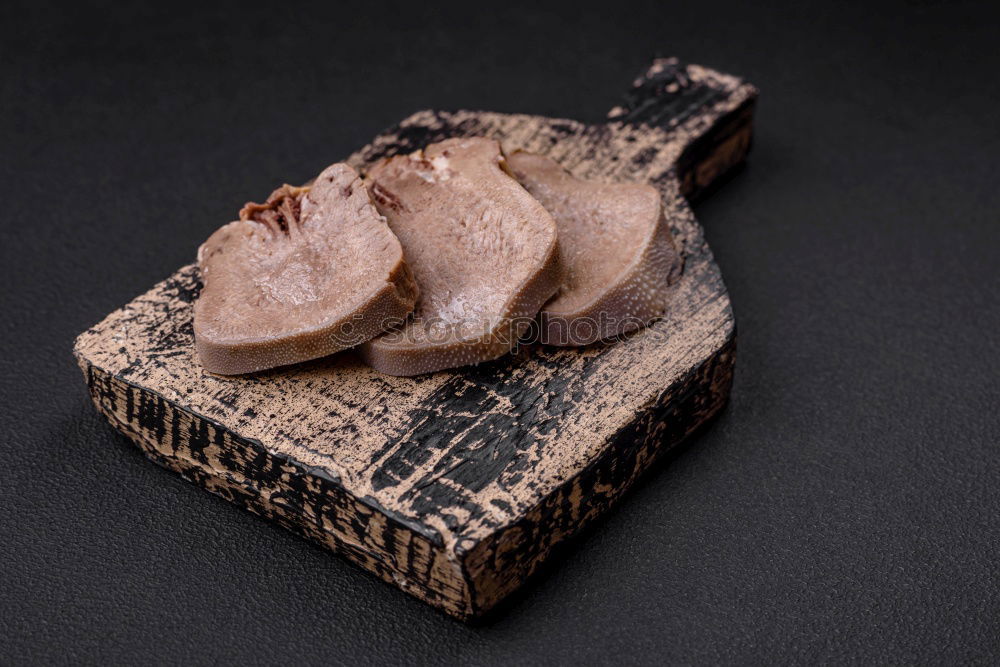Similar – Image, Stock Photo Dried fish in a bag with paper on a black surface