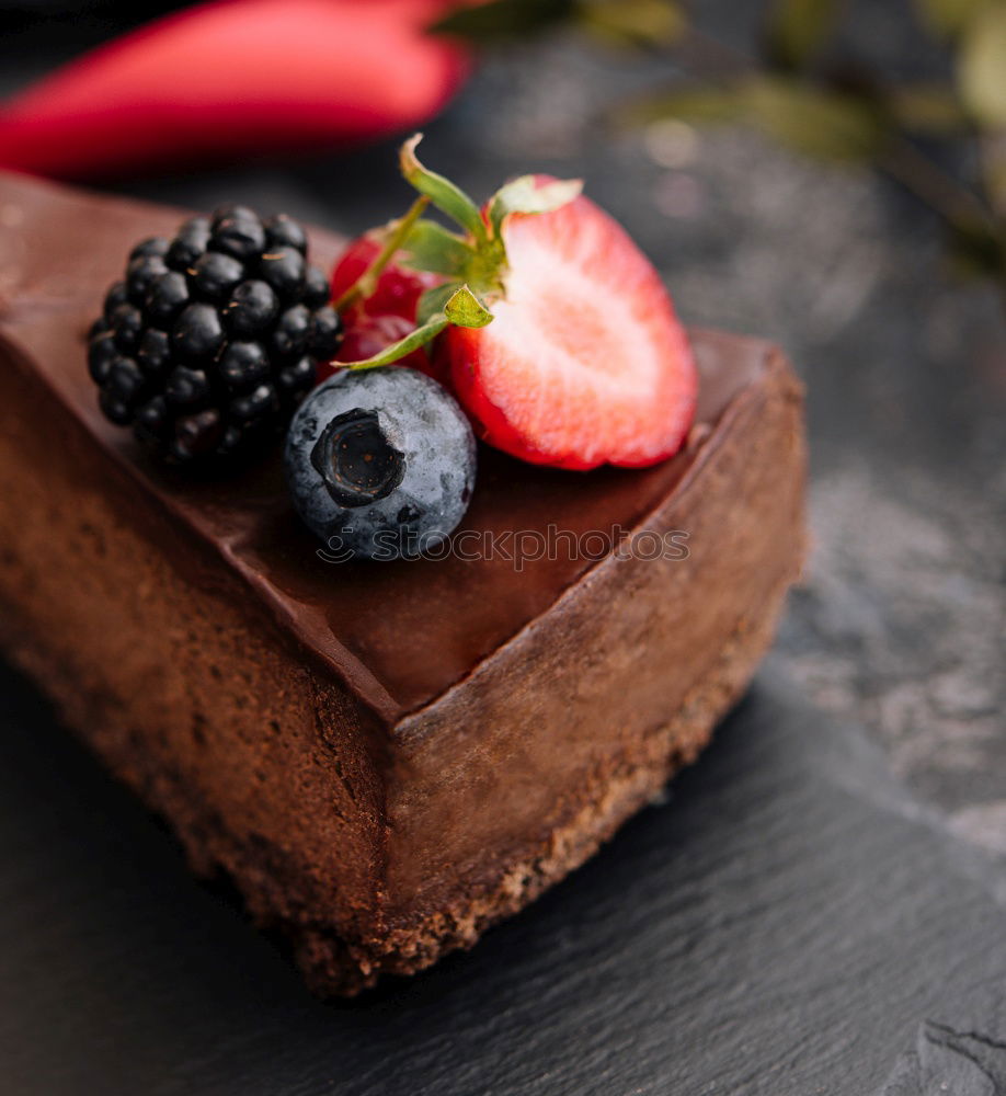 Similar – Image, Stock Photo Chocolate Tiramisu cake with strawberries on black slate