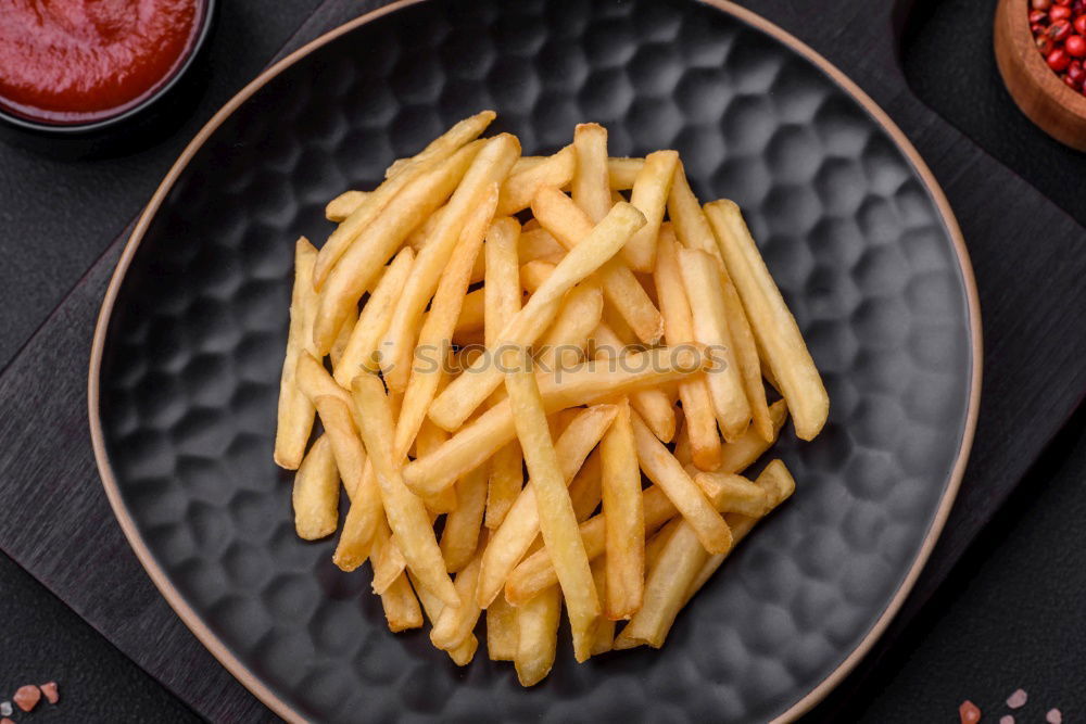 Similar – Salchipapas (Fries with Sausage) South American Fast Food