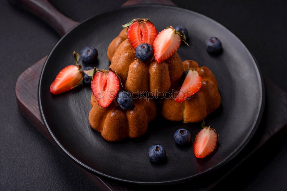 Similar – Image, Stock Photo Chocolate Tiramisu cake with strawberries on black slate