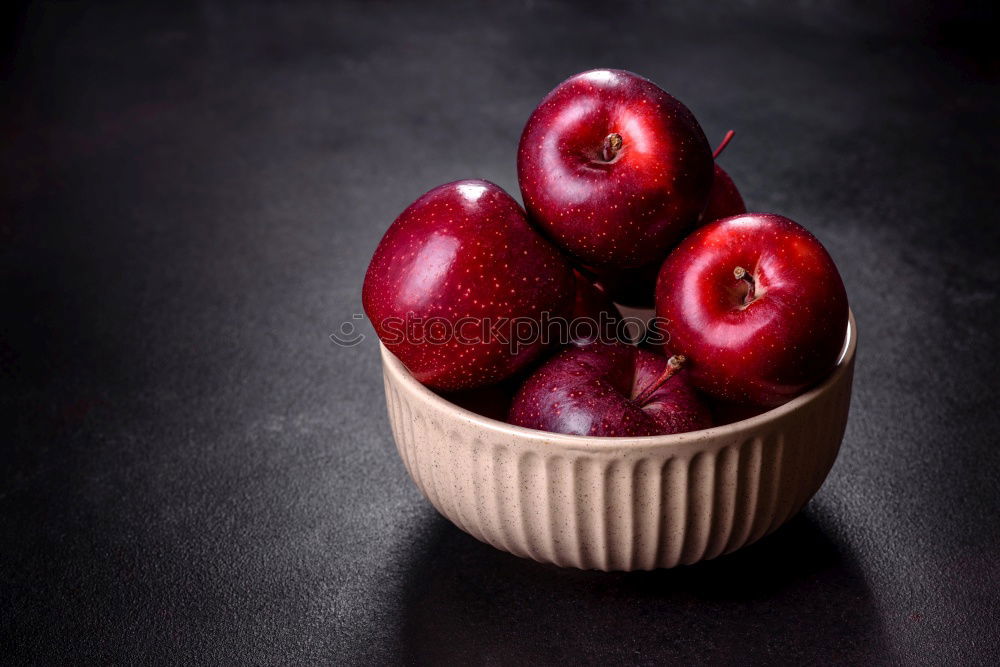 Similar – ripe red peaches in a wooden bowl on a table