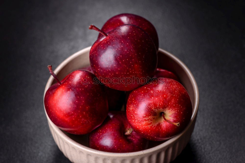 Similar – ripe red peaches in a wooden bowl on a table