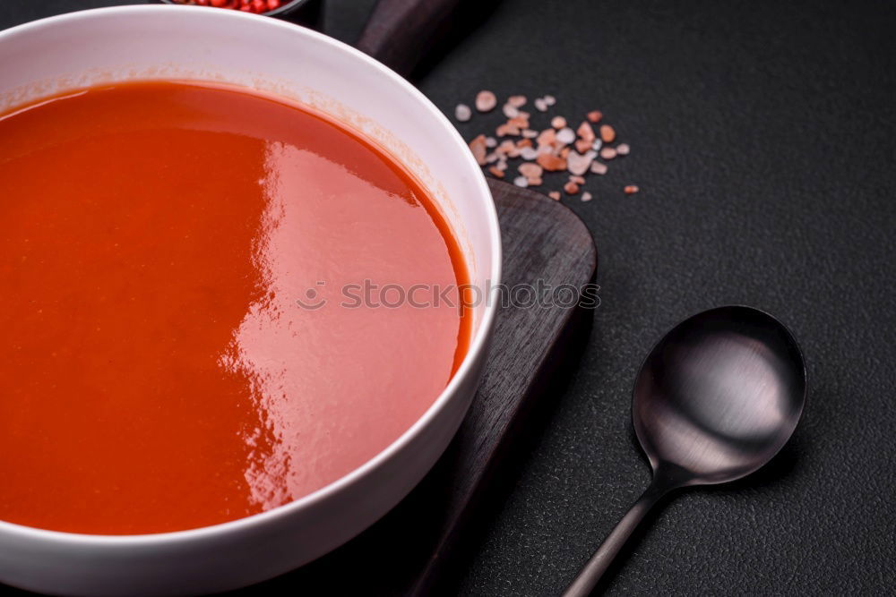 Similar – female hands holding an iron mug with carrot juice