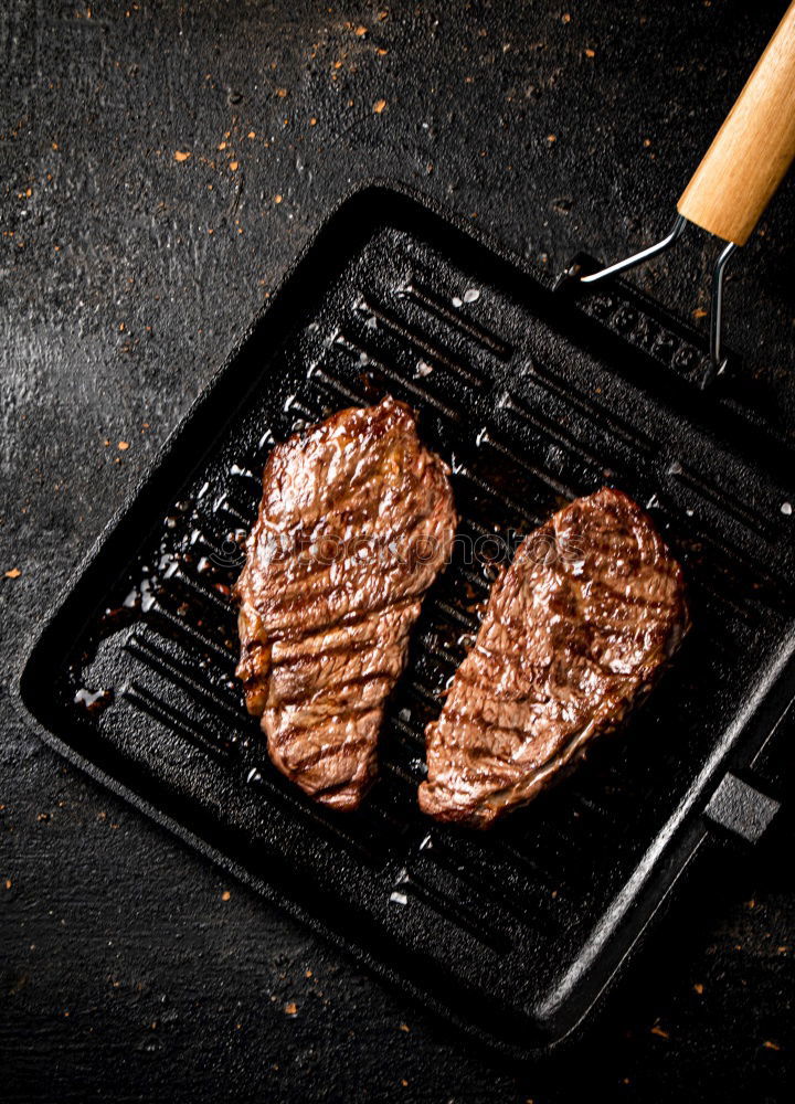 Similar – Image, Stock Photo Ribeye steak on grill iron pan