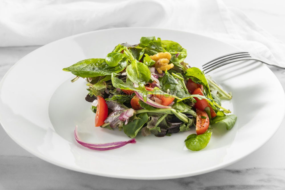 Similar – Mixed salad with baby leaves, radish, cucumber and feta cheese