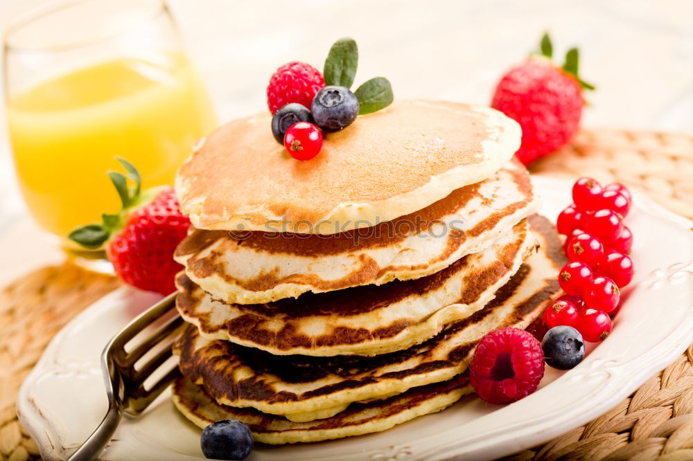 Similar – Pancakes with raspberries and blueberries