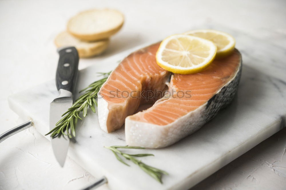 Similar – Fresh raw salmon on a wooden cutting board