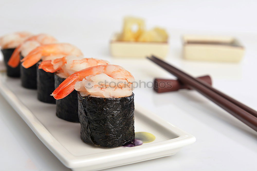 Similar – sushi assortment in white plate on black background