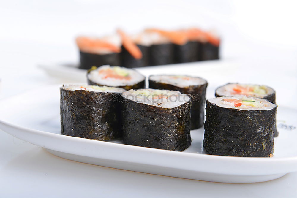 Similar – sushi assortment in white plate on black background