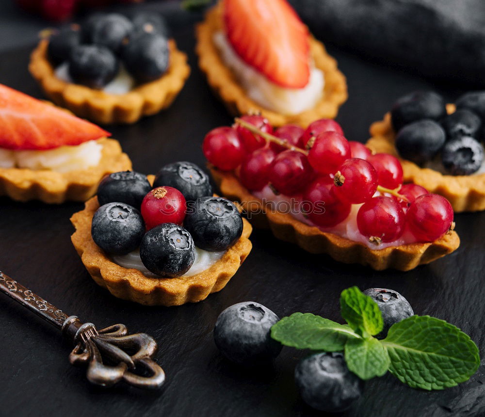 Similar – Image, Stock Photo Delicious tartlets with raspberries and blueberries