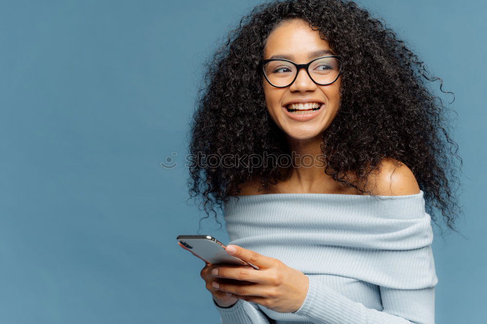 Similar – Image, Stock Photo Beautiful afro american woman using mobile in the street.