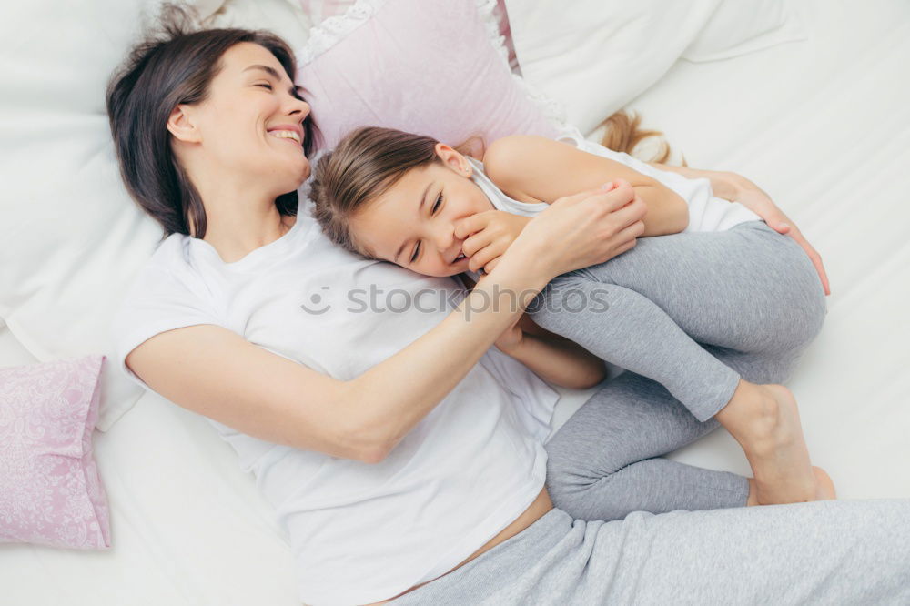 Similar – Image, Stock Photo mother and child son sleeping together in bed