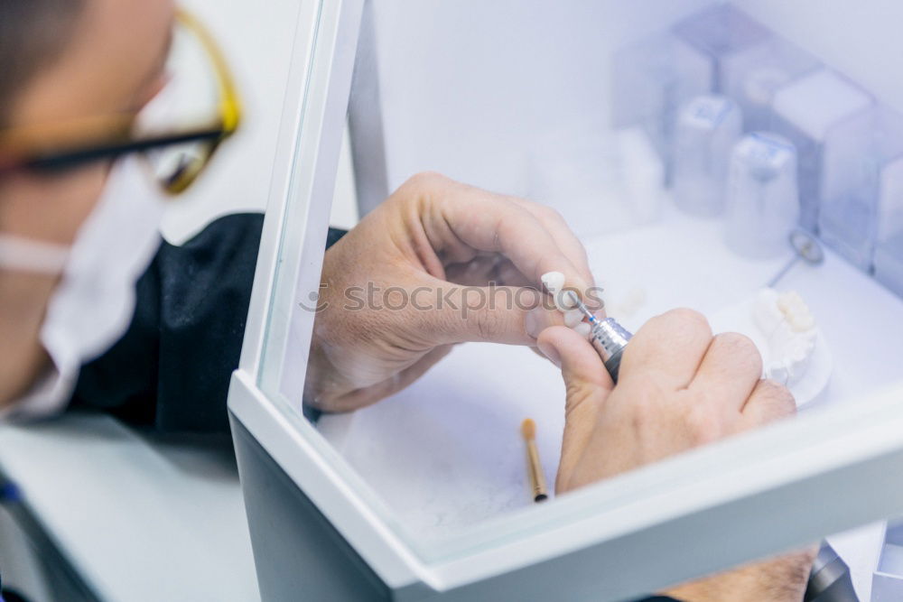 Similar – Close up on woman’s hands sewing needle and thread. Old woman working wasted hands .Tailor sewing some fabric. Details, low light, moody