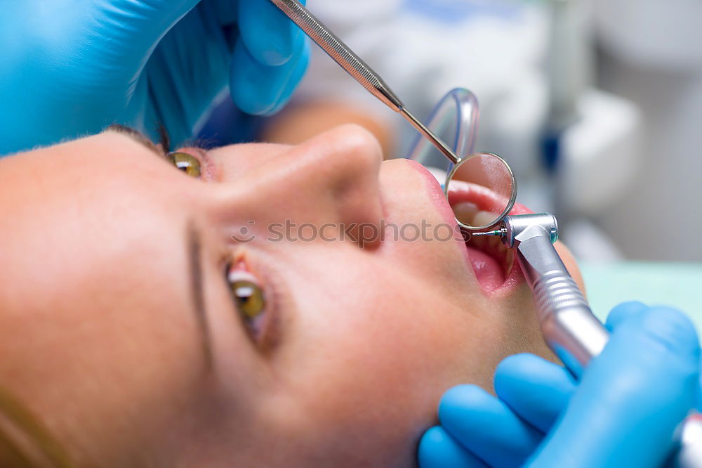 Similar – Seated young man is being examined his teeth by a dentist.