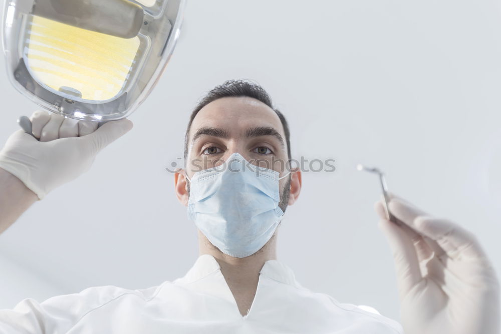 Image, Stock Photo Doctor with mask and tools.