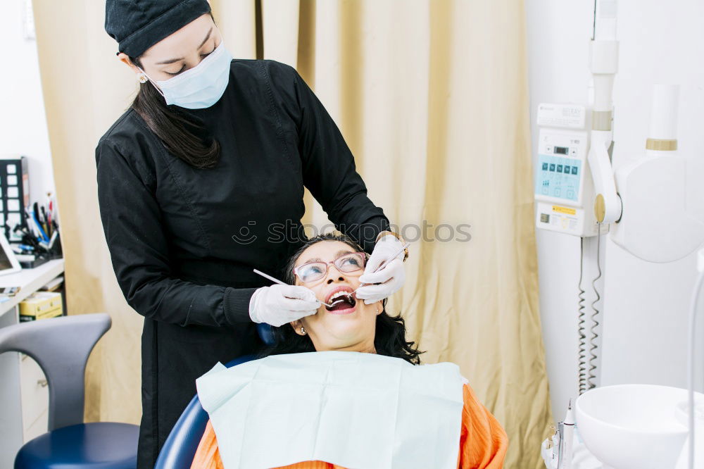 Similar – Image, Stock Photo A fragment of a dental room with a kid, lying on a dental chair, and a part of his doctors figure