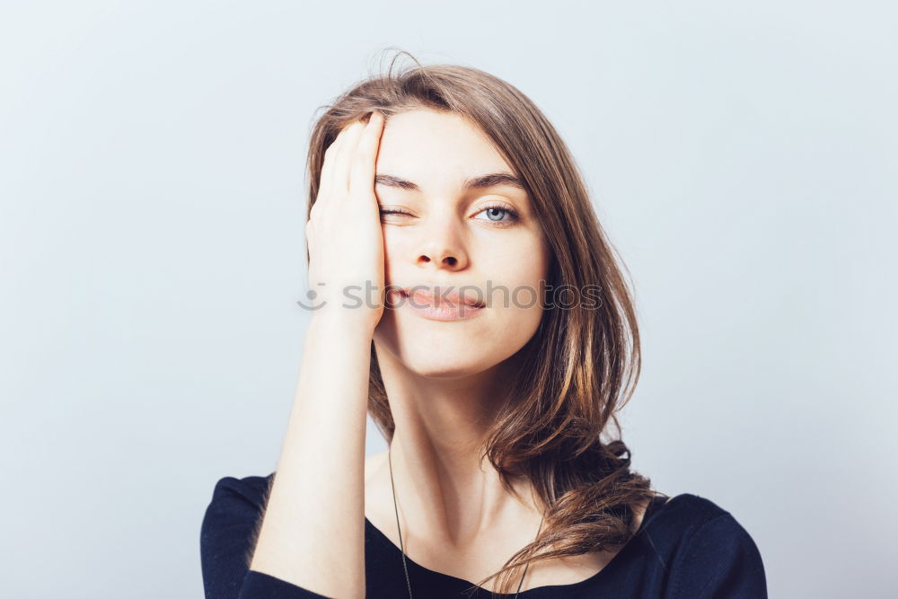 Similar – Close up portrait of a beautiful young woman