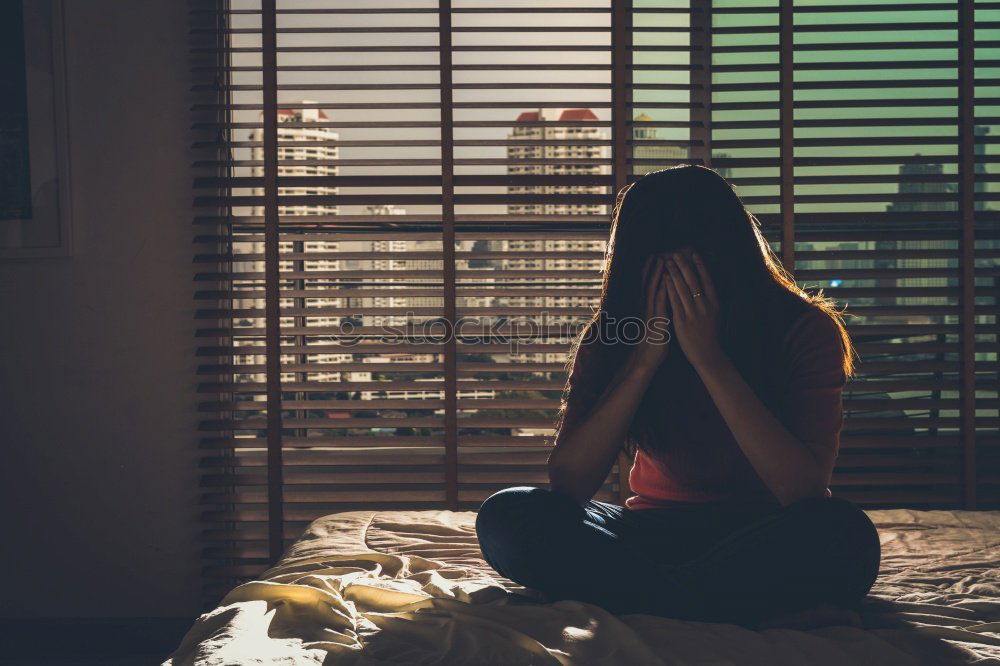 Similar – sad young woman sitting on bench